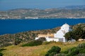 View of Milos island and Greek Orthodox traditional whitewashed church in Greece