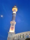 View of minaret the mosque at dusk before evening. The more beautiful because it seems the moon Royalty Free Stock Photo