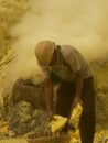 View on miners in the crater of the Ijen volcano in Indonesia, a sulfur mine and toxic gaz Royalty Free Stock Photo