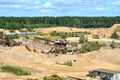 View on the mining quarry for the production of crushed stone, sand and gravel. Crusher plant with belt conveyor, crushing process Royalty Free Stock Photo