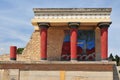 View of the Minoan Palace of Knossos with characteristic columns and a fresco of a bull behind. Crete, Greece