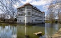 View of moated castle of Bad Rappenau at the beginning of spring with reflections in the castle moat Royalty Free Stock Photo