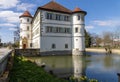 View of moated castle of Bad Rappenau at the beginning of spring with reflections in the castle moat Royalty Free Stock Photo