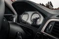 View from modern car instrument panel with gauges Royalty Free Stock Photo