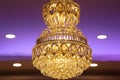 View of modern chandelier with diamond crystals and lights hung on the sealing Royalty Free Stock Photo