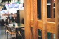 View of modern food court food hall interior in the big shopping mall, different fast food cafes and restaurants with wooden and Royalty Free Stock Photo