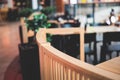 View of modern food court food hall interior in the big shopping mall, different fast food cafes and restaurants with wooden and Royalty Free Stock Photo