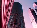 View through modern high rising skyscraper upwards to blue sky Royalty Free Stock Photo