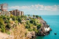 View of a modern multi storey resort hotel at Mediterranean sea coast at Antalya historical downtown. Royalty Free Stock Photo