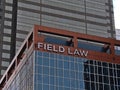 View of modern office building in Calgary downtown with lettering of legal services company Field Law (Field LLP).