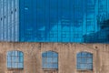 View on modern office building detail, glass surface.