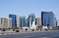 View of modern office buildings and a white coloured mosque across Baniyas Road in Deira Dubai