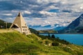 Pyramid shaped church and lake Mont-Cenis among mountains in France