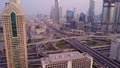 View on modern skyscrapers and busy evening highways day in luxury downtown of Dubai city. Top aerial view from tower