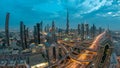 View on modern skyscrapers and busy evening highways day to night timelapse in luxury Dubai city, Dubai, United Arab Royalty Free Stock Photo