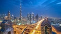 View on modern skyscrapers and busy evening highways day to night timelapse in luxury Dubai city, Dubai, United Arab Royalty Free Stock Photo