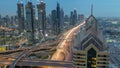 View on modern skyscrapers and busy evening highways day to night timelapse in luxury Dubai city, Dubai, United Arab Royalty Free Stock Photo