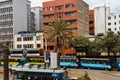 View of Moi Avenue Street with public transport vehicles and people on a busy day in Nairobi, Kenya