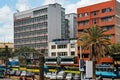 View of Moi Avenue Street with public transport vehicles and people on a busy day in Nairobi, Kenya