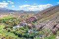 View of Montagu Springs valley and Mountain range with large red rocky outcrops and lush green vegetation, Montagu Springs