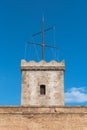 Turret of Montjuic Fortress with sun clock over blue sky. Barcelona, Spain