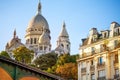 Sacre Coeur cathedral over classical Paris house