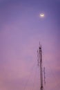 View of the moon on the dusk sky and the folded dipole radio ant
