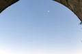 The view of the moon seen through the arch door. daylight hours. Royalty Free Stock Photo
