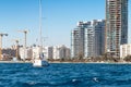 View of a moored yacht in front of Limassol cityscape. Cyprus