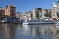 View of the mooring of pleasure boats on Damrak Street in Amsterdam Royalty Free Stock Photo