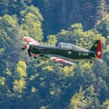 View of Morane-Saulnier M.S.406 fighter aircraft flying over the trees in Aerodrome Epagny Royalty Free Stock Photo