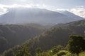 the view of the morning atmosphere at the foot of the mountains and the sun's rays shyly shining on the earth