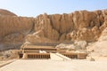 View of the Mortuary Temple of Queen Hatshepsut, located under the rocks in Deir el-Bahari, Valley of the Kings. Monument of Royalty Free Stock Photo