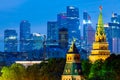 View of the Moscow Kremlin towers and Moscow City Skyscrapers during evening sunset blue hour Royalty Free Stock Photo