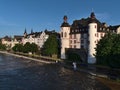 View of Moselle river at high water level with flooded promenade of town Koblenz and fortress castle Alte Burg.