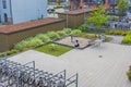 View of mother with child on playground in well organized modern leaving area.