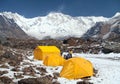 View of Mount Annapurna with tents and people Royalty Free Stock Photo