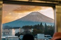 View of Mount Fuji at sunset through a train window. Mt. Fuji during transit at Kawaguchiko Station, Yamanashi, Japan. landmark