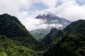 View of Mount Merapi in the morning, and slightly covered by clouds. Potentially eruptive volcano