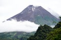 View of Mount Merapi in the morning, and slightly covered by clouds. Potentially eruptive volcano