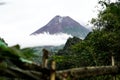 View of Mount Merapi in the morning, and slightly covered by clouds. Potentially eruptive volcano