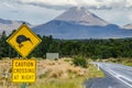 View of Mount Ngauruhoe - Mount Doom from road in Tongariro National Park with kiwi caution crossing at night sign in Royalty Free Stock Photo