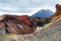 View of Mount Ngauruhoe - Mount Doom from Tongariro Alpine Crossing hike with clouds above and red crater in foreground Royalty Free Stock Photo