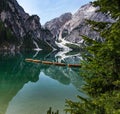View Of Mount Seekofel And Boats In The Evening Light, Mirroring In The Clear Calm Water Of Iconic Mountain Lake Pragser Wildsee
