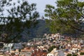 View of Mount Tibidabo through the branches of pine trees. Royalty Free Stock Photo
