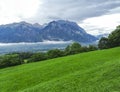 View from the mountain. Clouds, sky, green grass, mountains. Switzerland Royalty Free Stock Photo