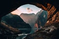 A view of a mountain from inside a cave.