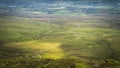 View from the mountain peak on winding wooden path of Cuilcagh Park boardwalk illuminated by sunlight Royalty Free Stock Photo