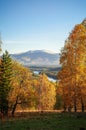 View of Mountain Peaks covered with snow and a wide mountine valley with a vinding river Royalty Free Stock Photo