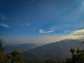 The view of mountain range in the background from Mount Angsi, Negeri Sembilan, Malaysia. Hiking and trekking image. Royalty Free Stock Photo